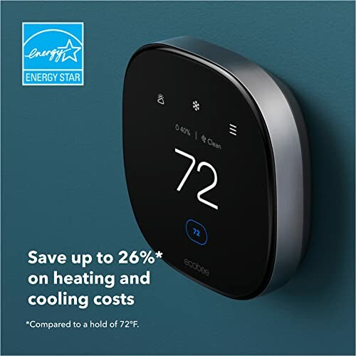 Smart thermostat on wall with energy savings text.