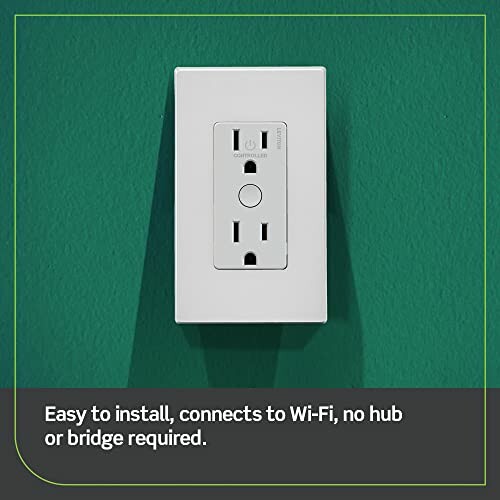 Smart WiFi outlet installed on green wall.